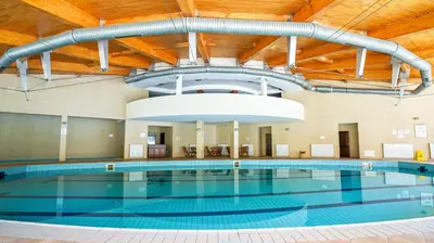 an indoor pool with a large swimming pool at Borika Hotel in Chepelare