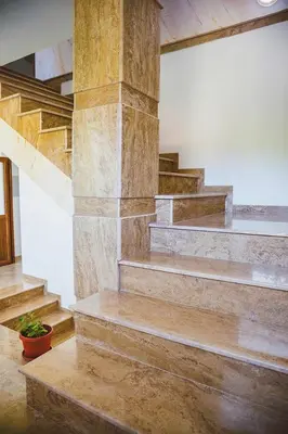 a group of stairs in a building with a plant at Стаи за гост Хит Хаус и СПА in Bratsigovo