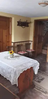 a dining room with a table with a white table cloth at Mechta Guest House in Koprivshtitsa