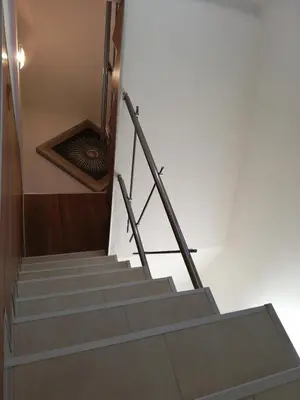 a set of stairs with a metal hand rail at стаи за гости Диневи in Kalofer