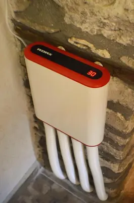 a red and white toothbrush sticking out of a wall at EskiZ - Our stone home in Chepelare