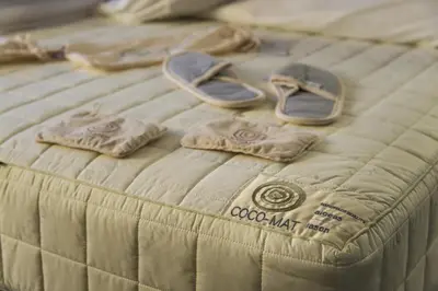 a bed with a pair of shoes on top of it at Ores Boutique Hotel in Bansko
