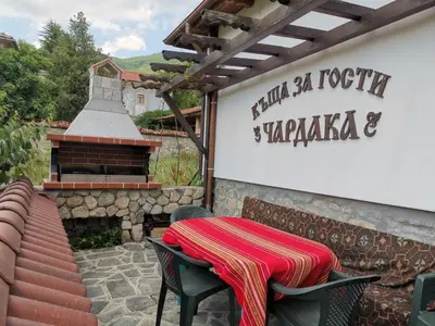 a table and chairs sitting outside of a restaurant at Възрожденски комплекс Чардакъ Сопот in Sopot