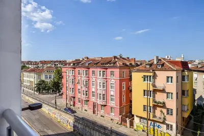 a view from a window of a city with buildings at Palace of Culture 2-Bedroom Retreat on Skobelev blvd in Sofia