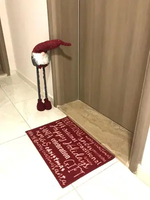 a red rug on the floor next to a door at Plovdiv City Center Kapana with garage in Plovdiv