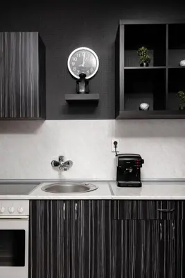 a kitchen with a sink and a clock on a counter at VITOSHKA Pleasure place in Sofia