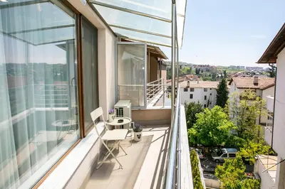 a balcony with a view of a city at South Place Apartments in Sandanski