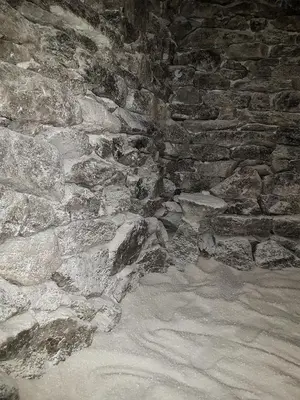 a stone wall with a bunch of rocks at Апартаментен туристически комплекс Аква Терми in Krasnovo