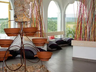 a room with a bunch of pots and windows at Апартаментен туристически комплекс Аква Терми in Krasnovo
