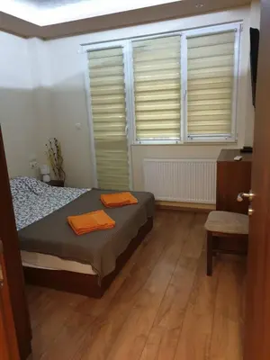 a bedroom with a bed and a window with blinds at Luxury 2 bedroom,2 bathroom apart ,free parking in Plovdiv