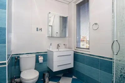 a bathroom with a toilet and a sink and a shower at Stunning location and views!Foothills of Old town! in Plovdiv