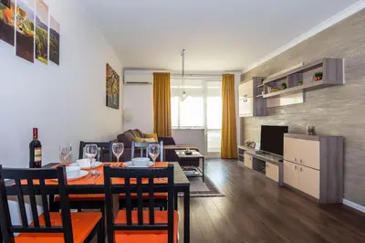 a living room and kitchen with a table and chairs at Stunning location and views!Foothills of Old town! in Plovdiv