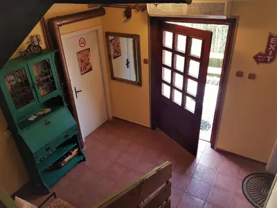 an overhead view of a hallway with a door at Casa Vivaldi in Velingrad
