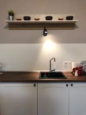 a kitchen with a sink and a counter top at Apartment The Orchid in Sofia