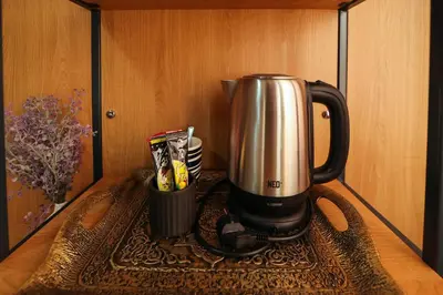 a coffeemaker sitting on top of a table at Family Hotel Gotse Delchev in Gotse Delchev