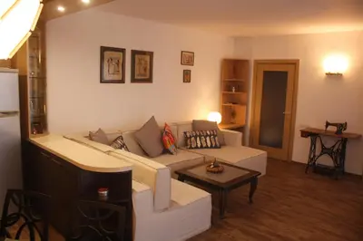 a living room with a couch and a table at Central Square Apartment in Plovdiv