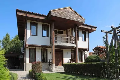 a large house with a porch and a balcony at guest house Margarita in Bryagovo