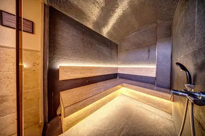 a small room with a sauna in a building at Cozy Studio in Mountain Lake Complex Smolyan Pamporovo in Smolyan