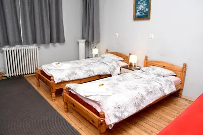 two twin beds in a room with at Santa Sofia in Sofia