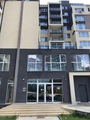 an apartment building with the front door open at Business sky Loft in Sofia