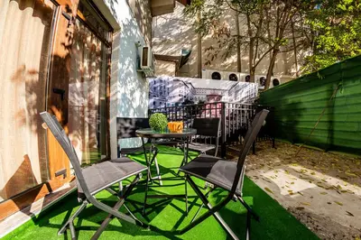 a pair of chairs and a table on a patio at Sofia Rococo Life Apartments in Sofia