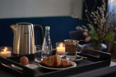 a tray with candles and food and drinks on a table at The Embassy Suites in Sofia