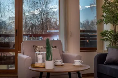 a living room with a coffee table and a couch at Charming Ski Apartments Near Gondola & Bar Street, Cedar Lodge 1 Complex in Bansko