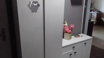 a white refrigerator with flowers on a white cabinet at MVK in Sofia