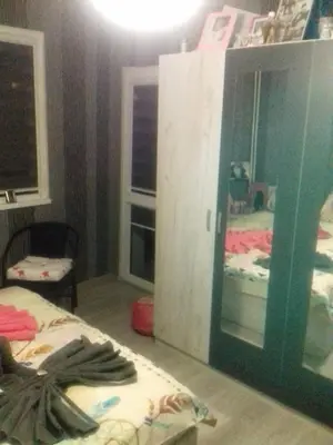 a room with two beds and a mirror at MVK in Sofia