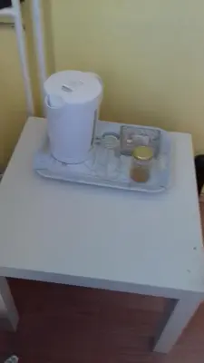 a white table with a container on top of it at MVK in Sofia
