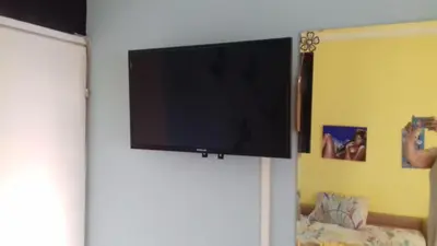 a flat screen tv hanging on a wall at MVK in Sofia