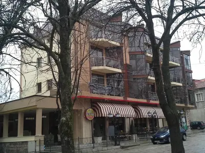 a building on a street with trees in front of it at Fantasy Apartment 15 комплекс Фантазия, Хисаря in Hisarya