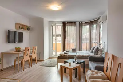 a living room with a couch and a table at Studio Talisman II in Sofia