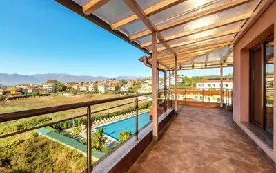 a view from the balcony of a house with a swimming pool at Elegance Spa Hotel in Ognyanovo