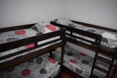 two bunk beds sitting next to each other in a room at Private apartment in Prespa in Bansko