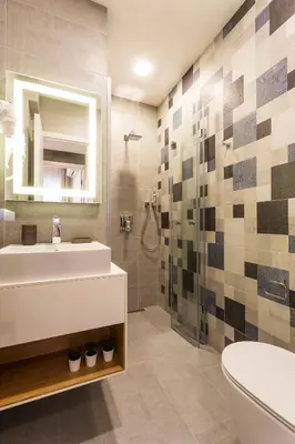 a bathroom with a sink and a toilet and a shower at SCA Sofia City Apartments in Sofia