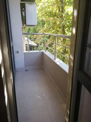 a view of a balcony from a door with a window at Луксозен апартамент в идеалния център на град Сандански in Sandanski