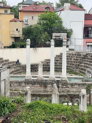 a group of columns on top of some stairs at Dara House in Plovdiv