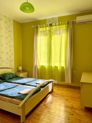a bedroom with a bed and a window at Serdika station, bright and cozy apartment in Sofia