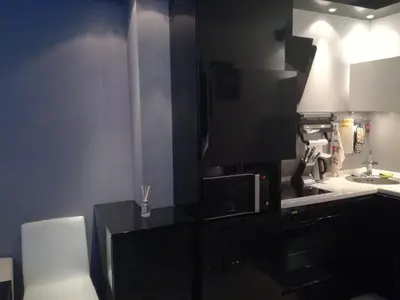 a kitchen with a microwave and a sink at Apartment 33 in Hotel Iceberg in Borovets