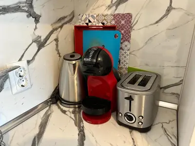 a counter with a coffee maker and a toaster at Luxury apartments in St. John Park in Bansko