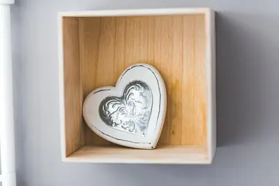 a wooden box with a heart in it at The Red Roof House in Plovdiv