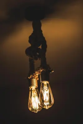 a couple of lights hanging from a ceiling at The Red Roof House in Plovdiv