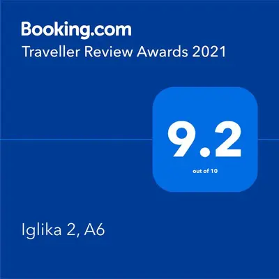 a screenshot of a phone with the travel review awards at Iglika 2, A6 in Borovets