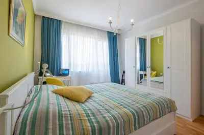 a bedroom with a bed and a desk and a mirror at FUNKY FRESH place in the heart of Sofia in Sofia