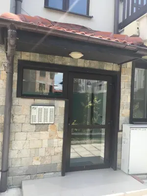 a front door of a building with a window at BanskoSuperSki in Bansko