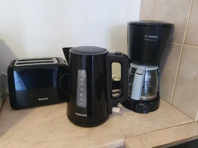 two coffins and a coffee maker on a counter at Flora Apartments TMF in Borovets
