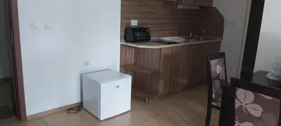 a kitchen with a small refrigerator and a sink at Vidima Apartment Hotel in Apriltsi