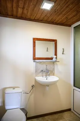 a bathroom with a toilet and a sink at Medi Guest House in Sapareva Banya