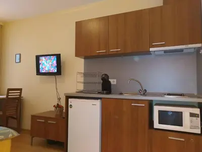 a kitchen with a white refrigerator and a microwave at Studio Villa Park 207 in Borovets